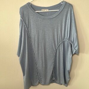 Free people Light Blue Short Sleeve Tee with knitted design on the front.